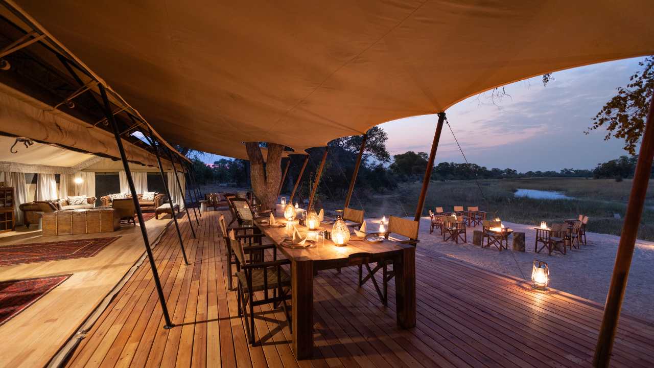 Main lodge deck at Okavango Explorers Camp in Botswana overlooking the Okavango Delta.