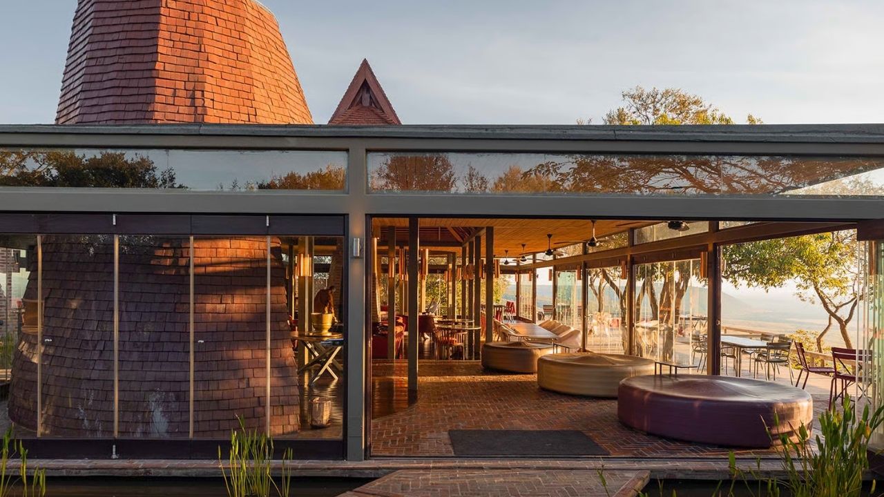 Glass entrance to deck and dining area at Angama Mara Safari Camp, Maasai Mara, Kenya.