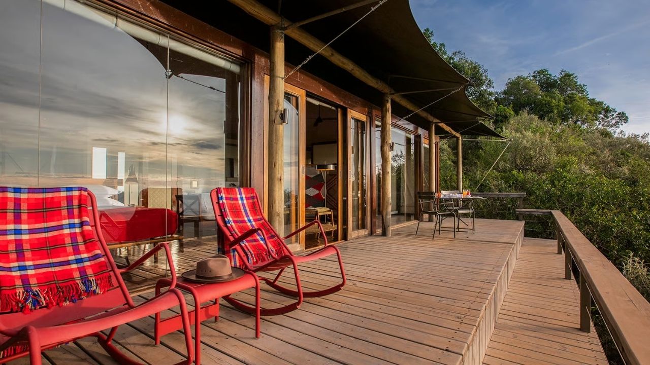 View of guest suite and deck at Angama Mara Safari Camp, Maasai Mara, Kenya, overlooking the bush.