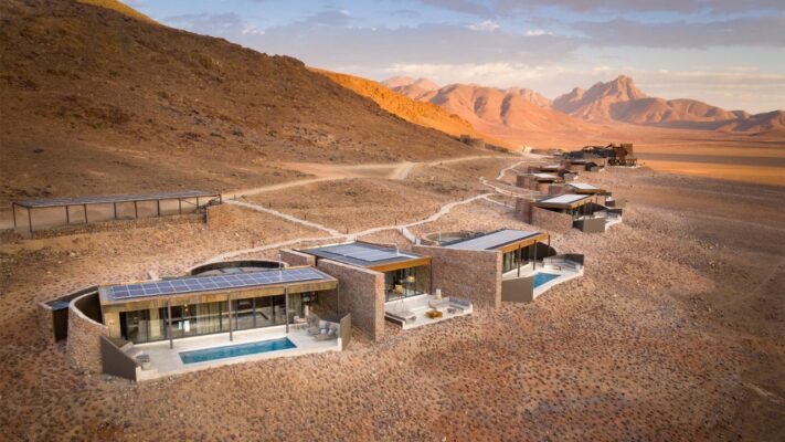 Aerial view of Sossusvlei Desert Lodge with dunes and Namib Desert in background