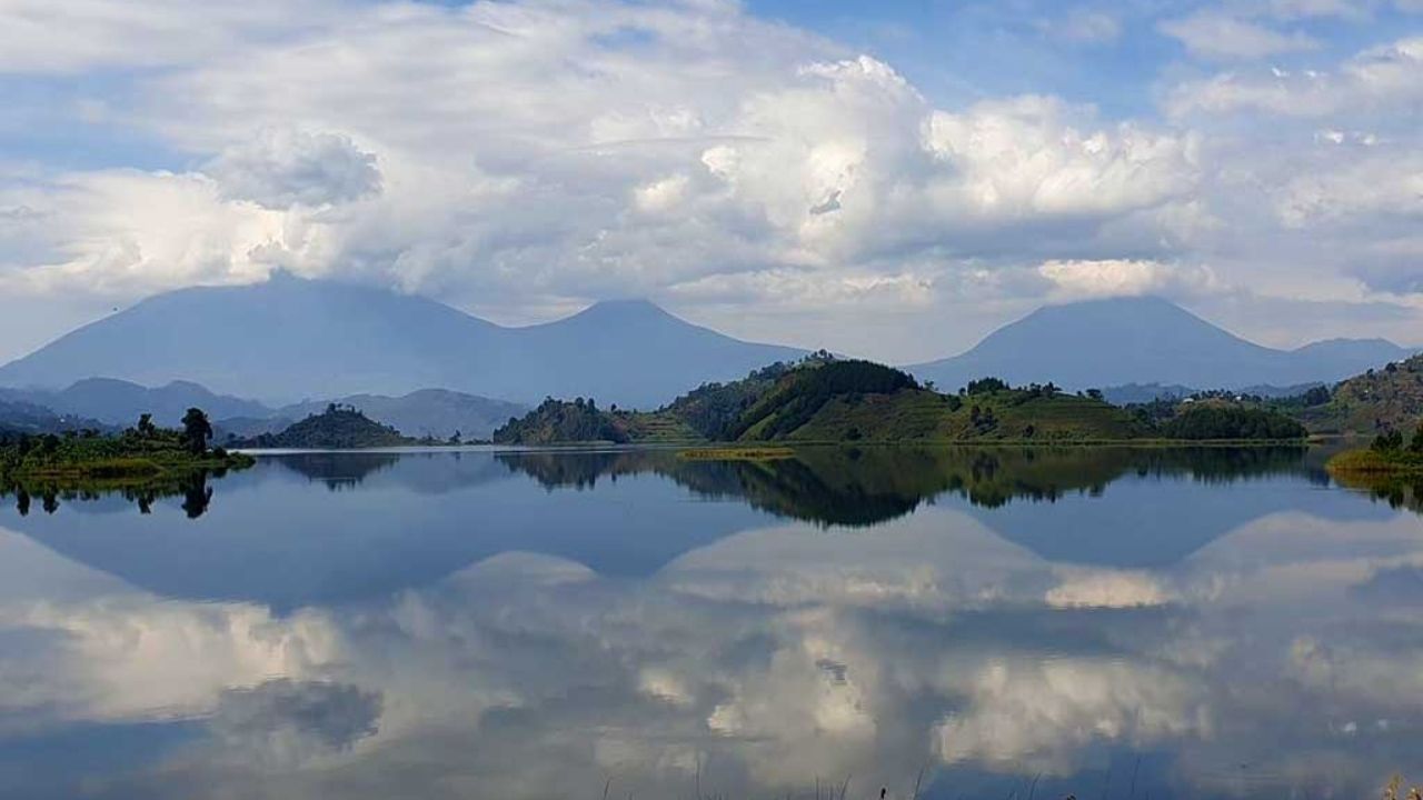 Calm Lake Mutanda with mountains in background