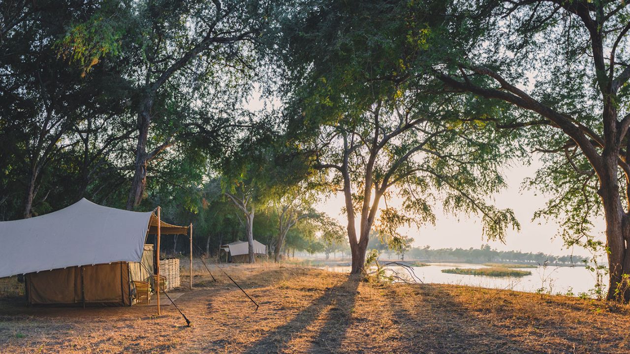 Guest suites at Kutali Safari Camp, Lower Zambezi National Park, Zambia at sunrise with lake view.