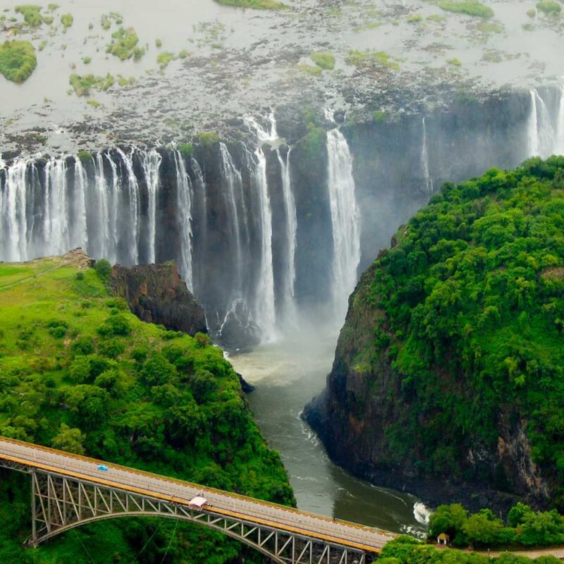 Aerial image of Victoria falls in summer with bridge in for ground.