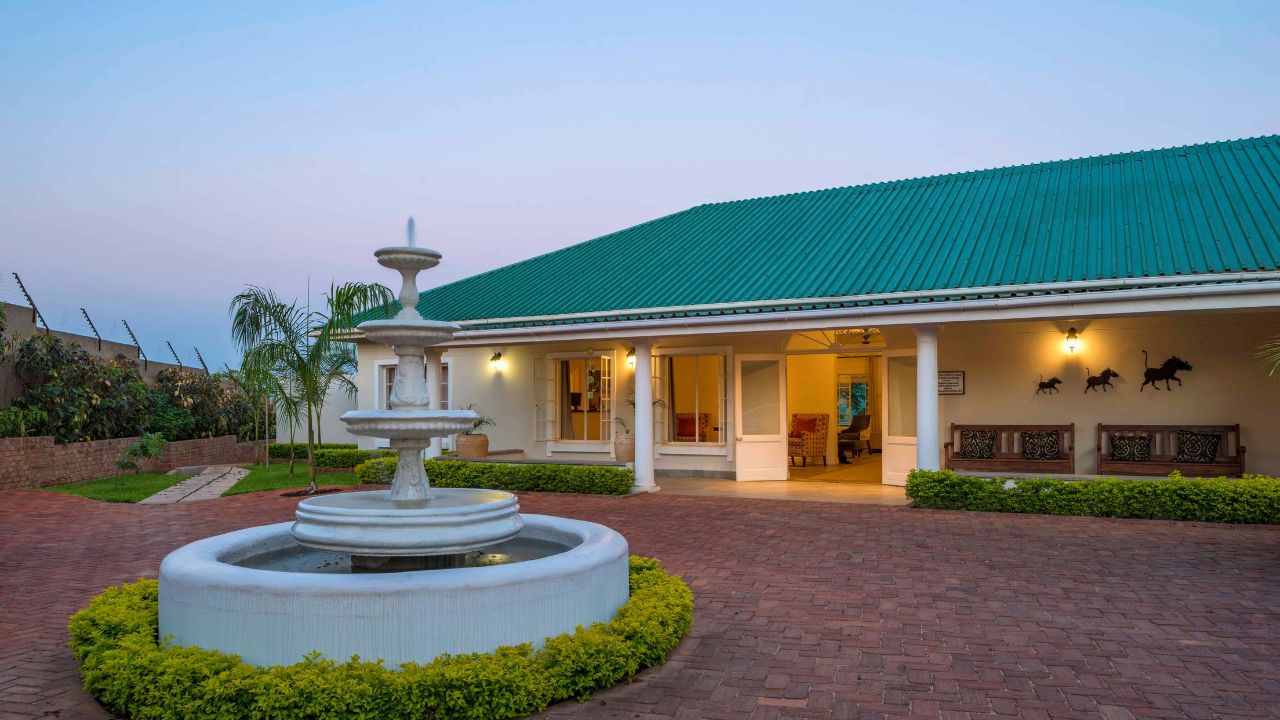 Fountain and reception area at Batonka Hotel at sunset
