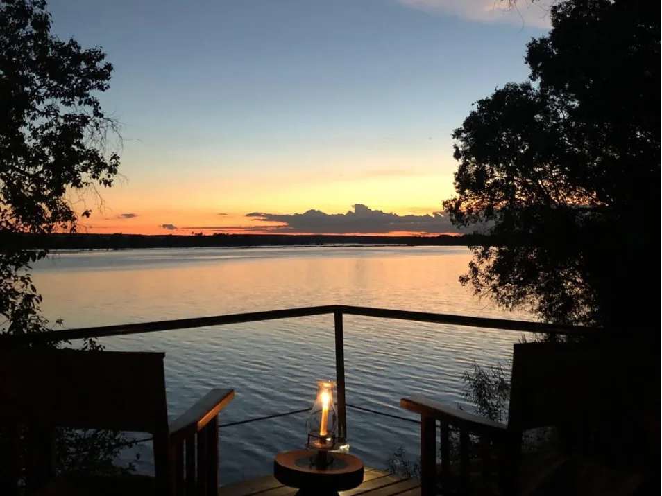 Sunset of Zambezi river from deck at Chundukwa Lodge Zambia
