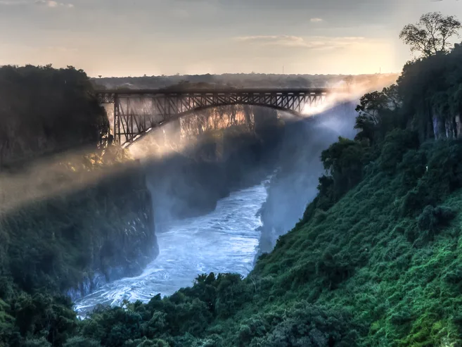 View of Victoria Falls at sunrise through the gorge of the Zambezi.