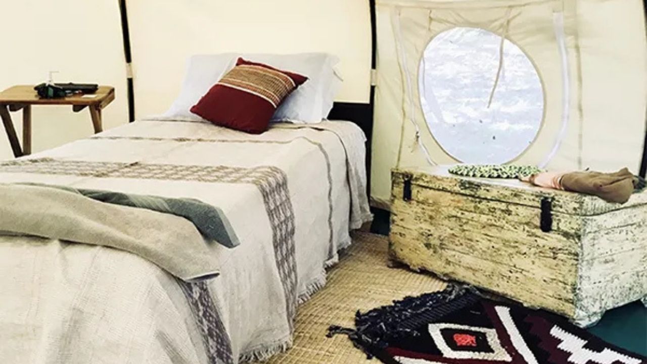 Interior of luxury Ethiopian tented accommodation with bed