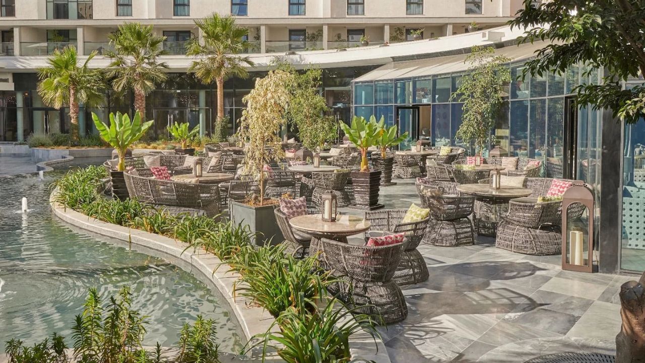 Hyatt Regency Addis Ababa outdoor dining with pond, Ethiopia