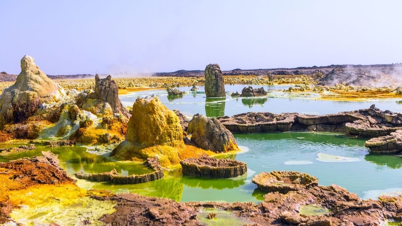 Colorful Danakil Depression landscape with green, orange, yellow hues, Ethiopia