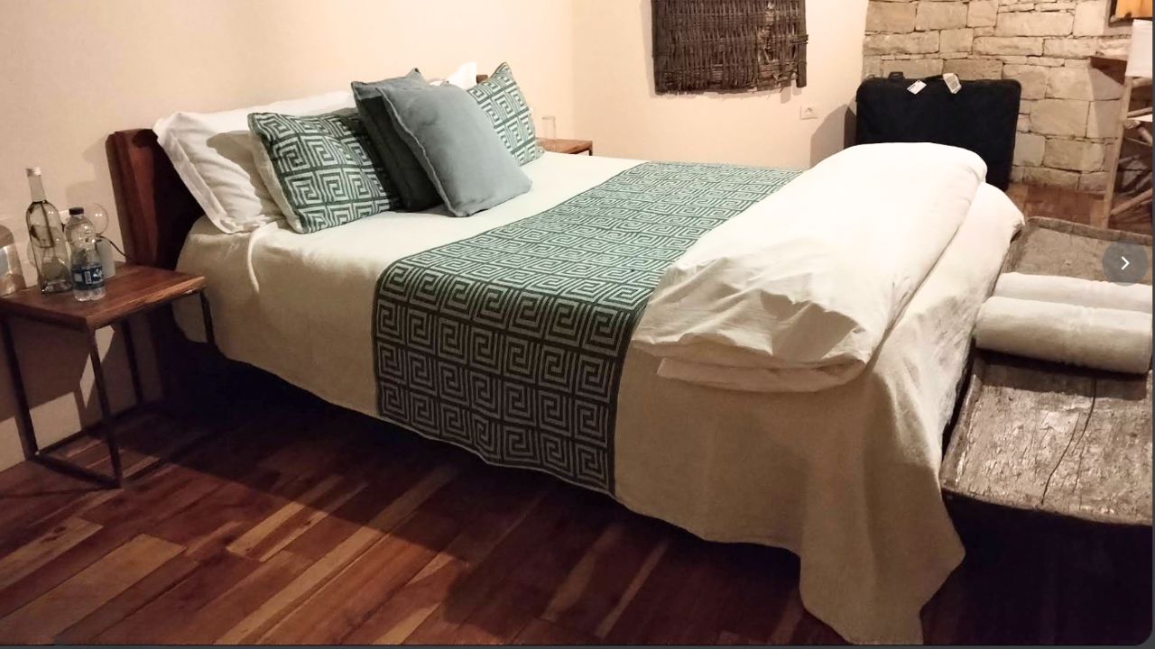 Double bed with green accents at Korkor Lodge, Gheralta Ethiopia