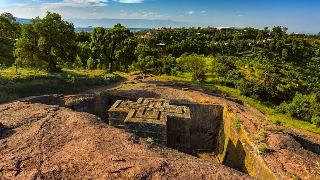 Aerial view of Lalibela cross church in pit with greenery, Ethiopia