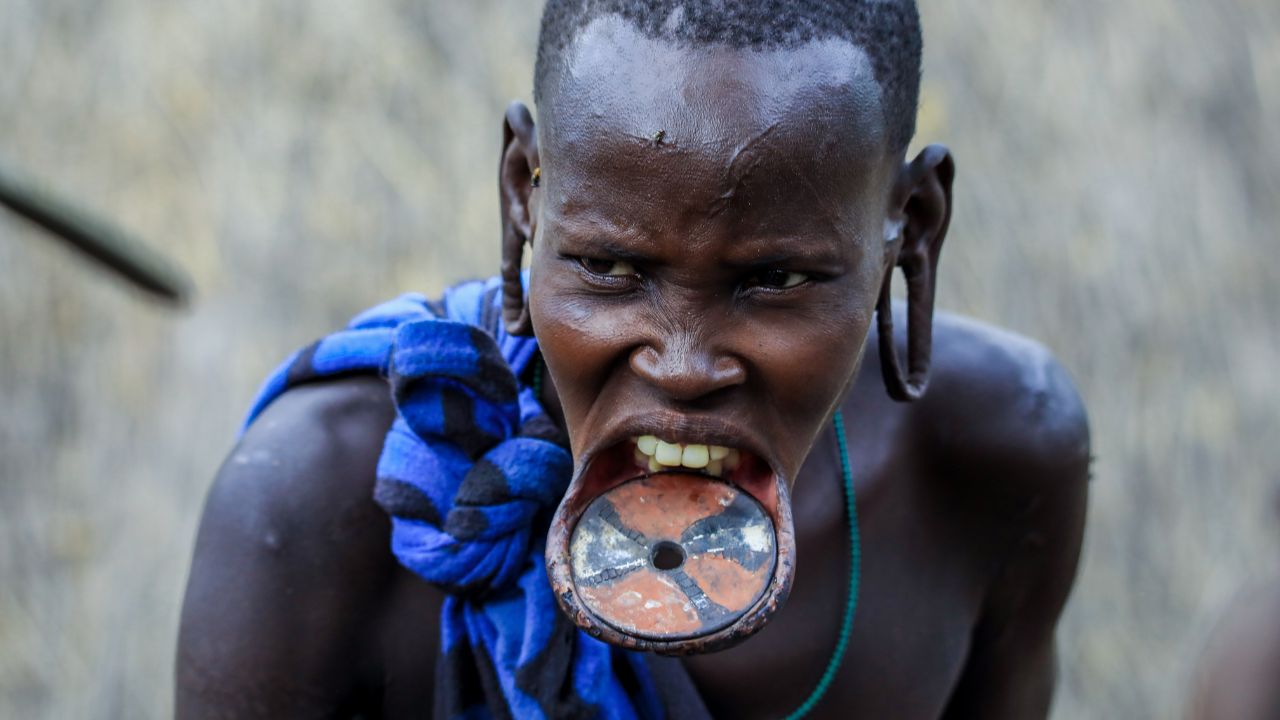 Ethiopian warrior with stretched bottom lip and ears
