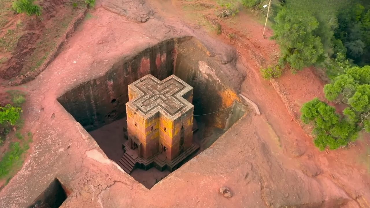 Aerial view from right angle of cross-shaped rock-hewn church in Lalibela.