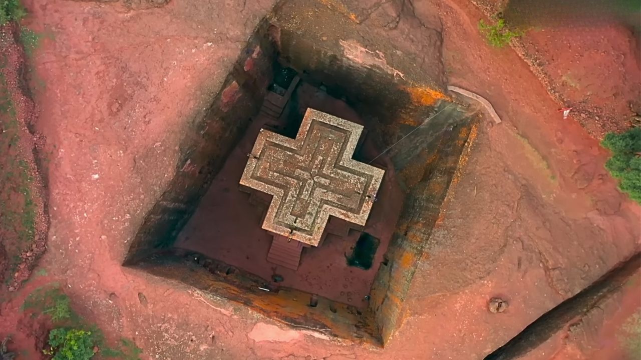 Aerial shot directly above Lalibela rock-hewn church looking down on roof and courtyard.
