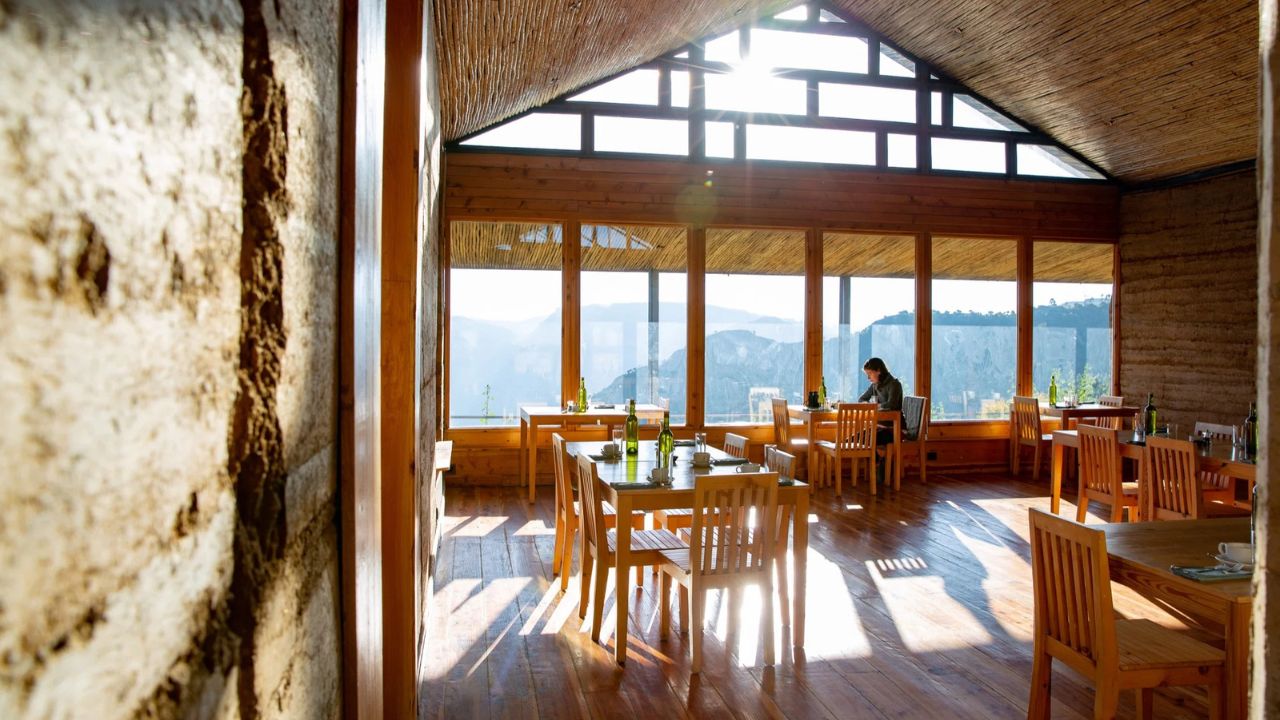 Reception area with large windows at LimaLimo Lodge, Simien Mountains