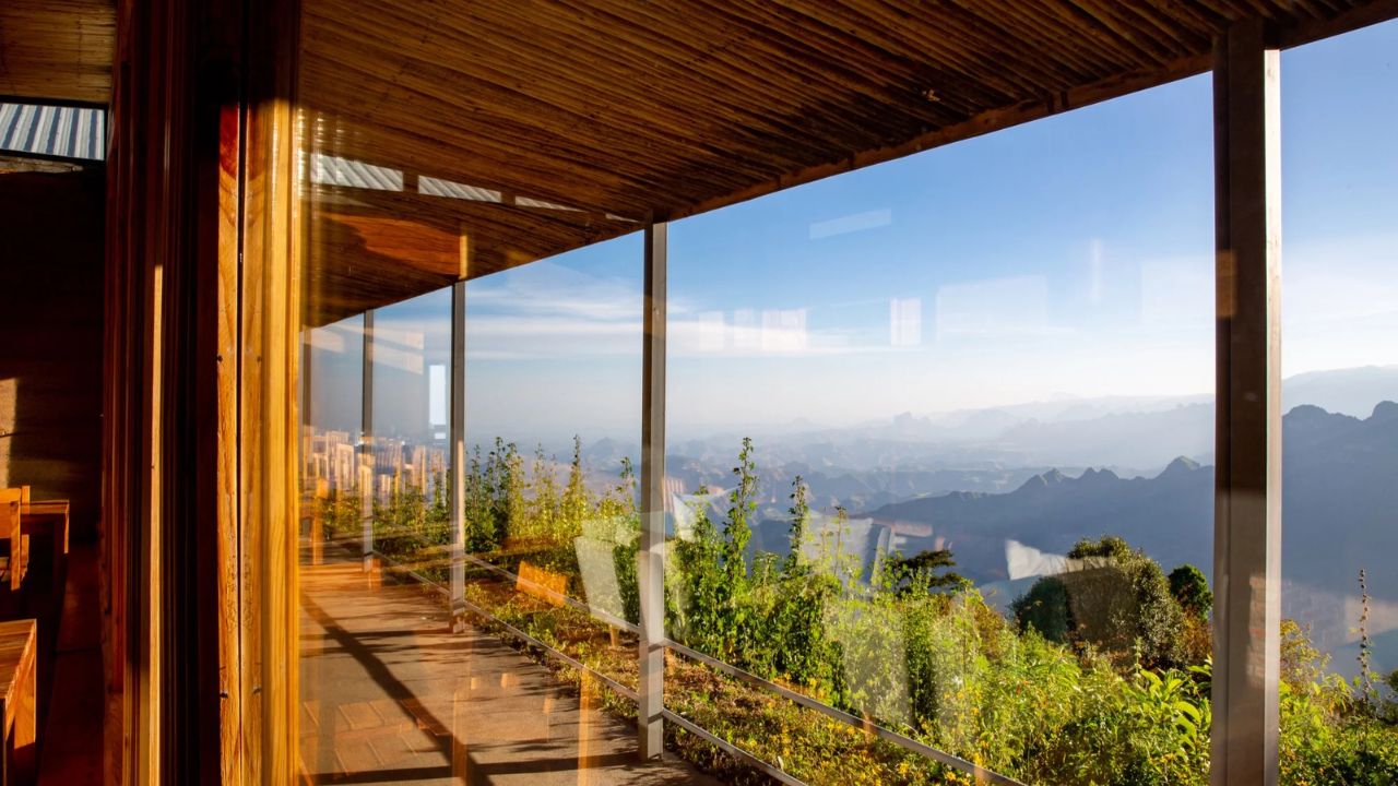 Walkway with glass windows overlooking Simien Mountains, LimaLimo Lodge
