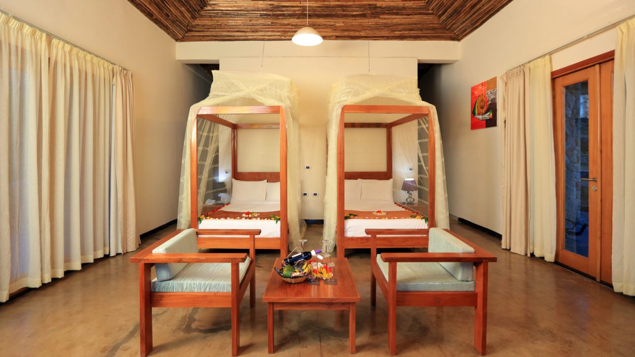 Twin guest room at Mezena Lodge with wooden accents, Ethiopia