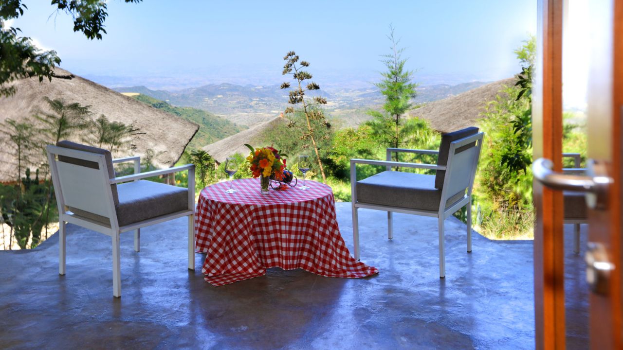 Terrace snack table at Mezena Lodge with mountain and valley views, Ethiopia