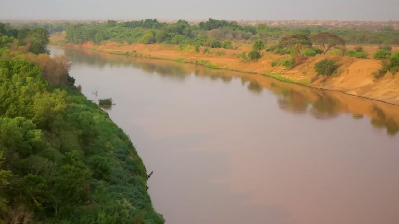 Omo River calm waters with greenery and sandbanks Ethiopia