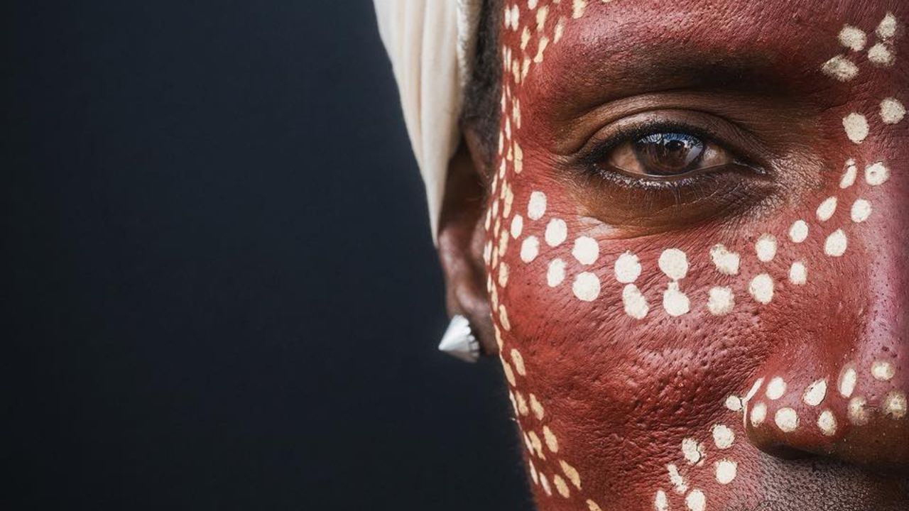 Omo Valley tribal woman with red face paint and white dots