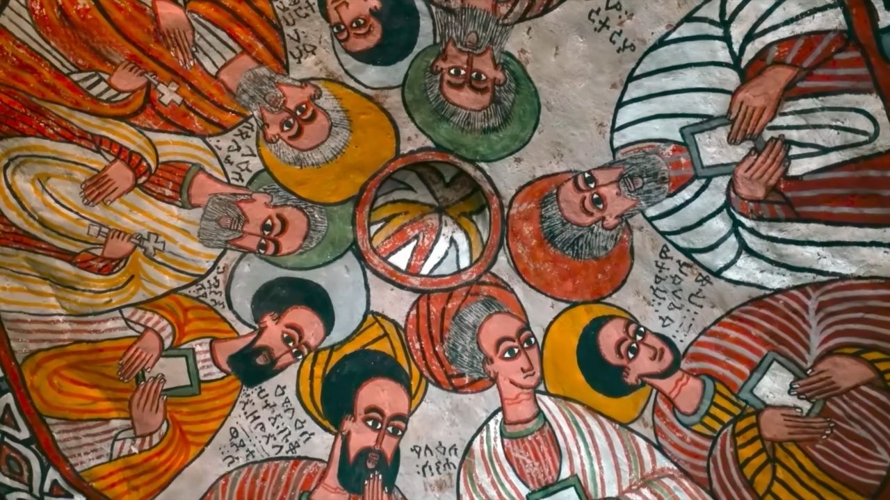 Ceiling painting of disciples in bright, vivid colors inside Abuna Yemata Guh monastery.