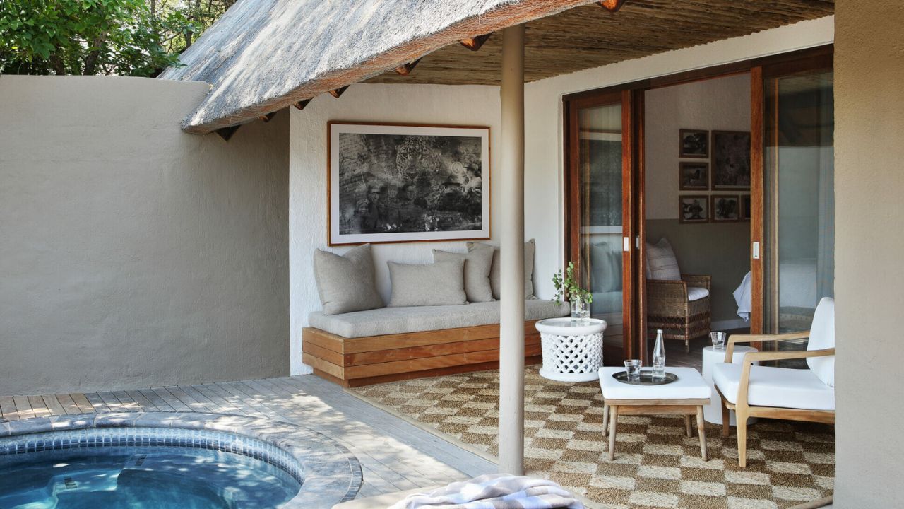 Luxury suite with private plunge pool and thatched roof at Londolozi Varty Camp