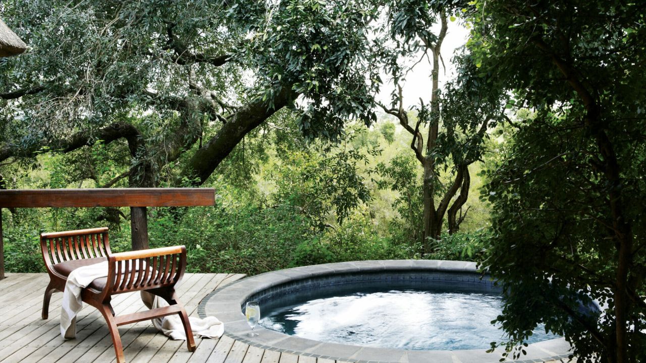 Private plunge pool on deck overlooking bush at Londolozi Varty Camp