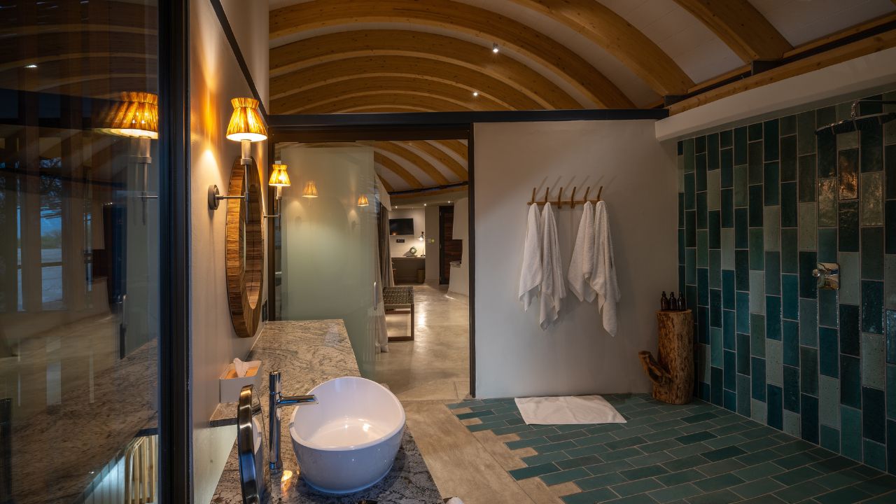 Guest suite bathroom with basin, shower, and modern fixtures