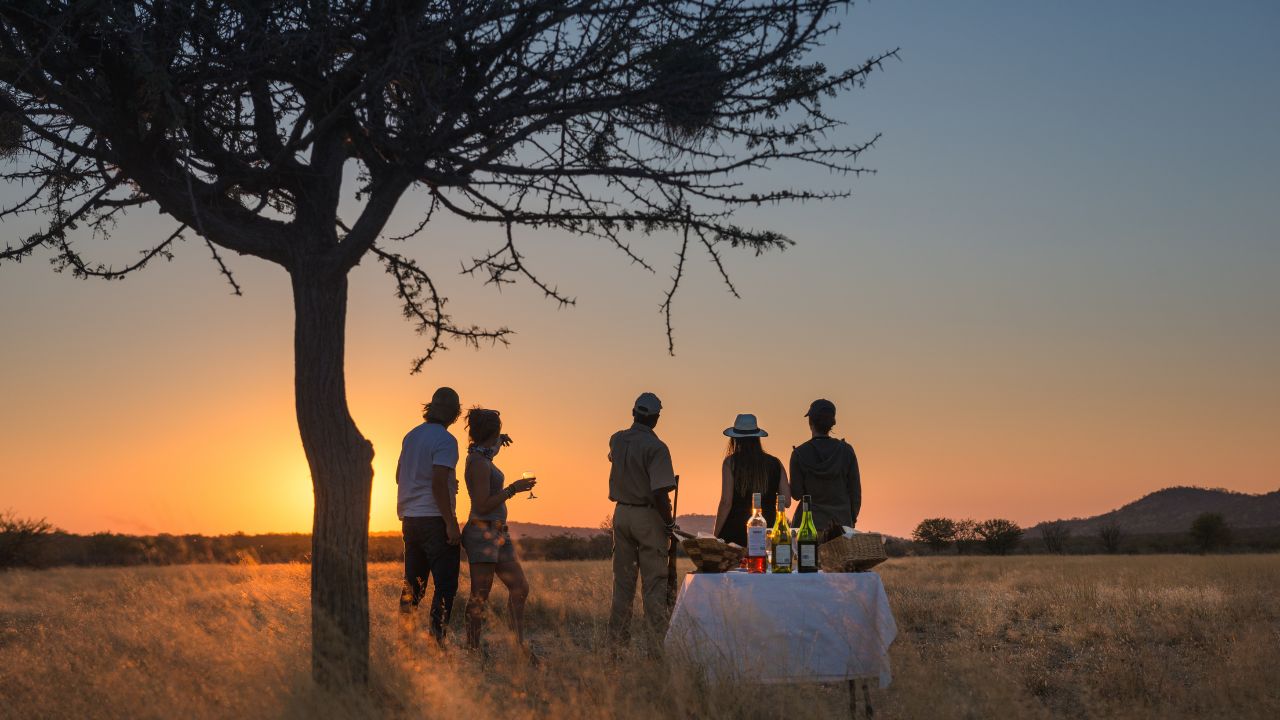 Sunset drinks in the middle of the desert during private game drive