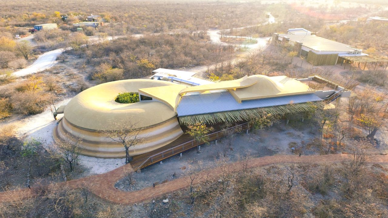 Aerial view of Anderssons at Ongava main lodge with dumbbell-shaped building surrounded by desert
