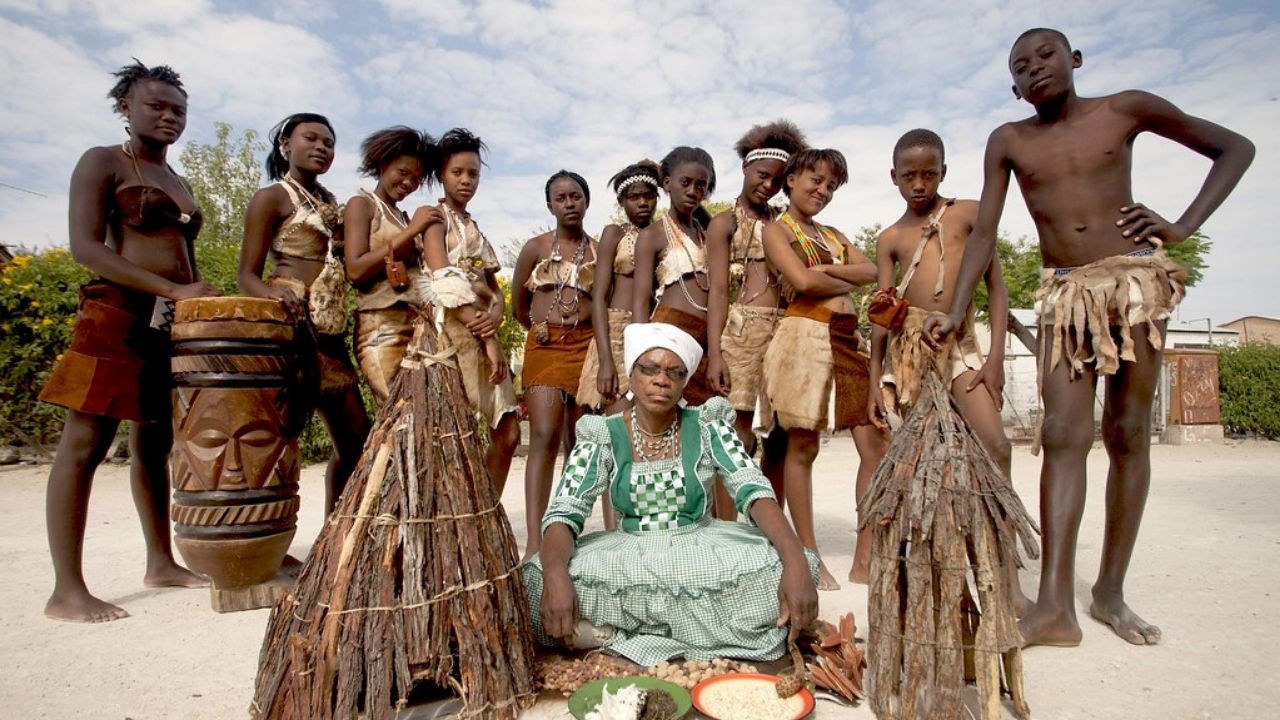 Namibian cultural tribe gathering during festival, desert setting