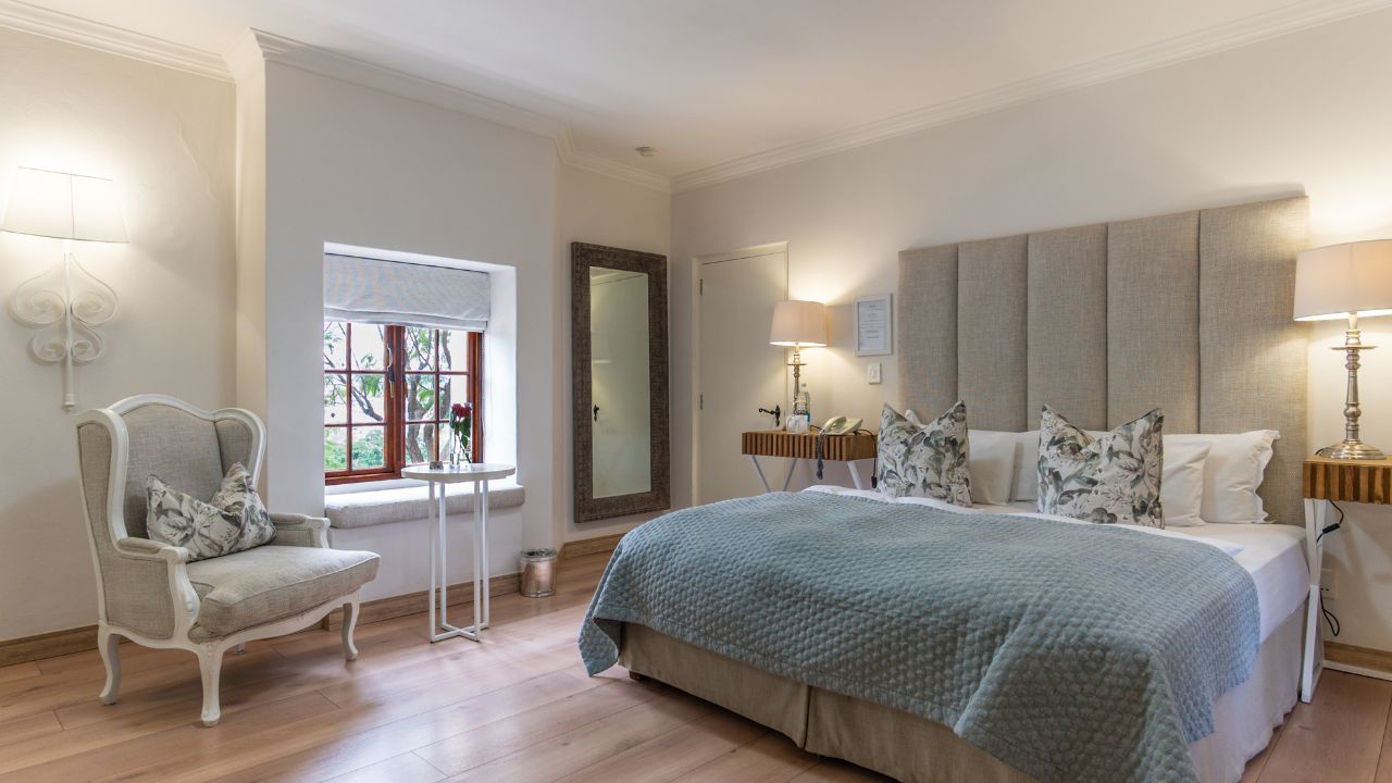Superior double room at Heinitzburg Boutique Hotel with double bed and elegant decor
