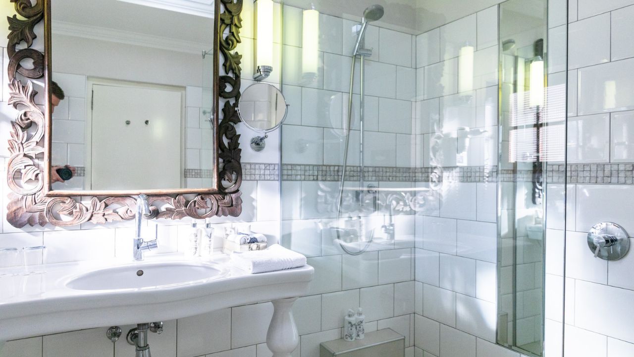 Basin and shower in comfort double room at Heinitzburg Boutique Hotel