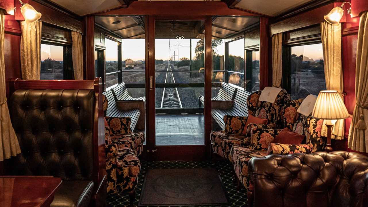 Rear carriage with open-air viewing deck on the Rovos Rail luxury train in South Africa.
