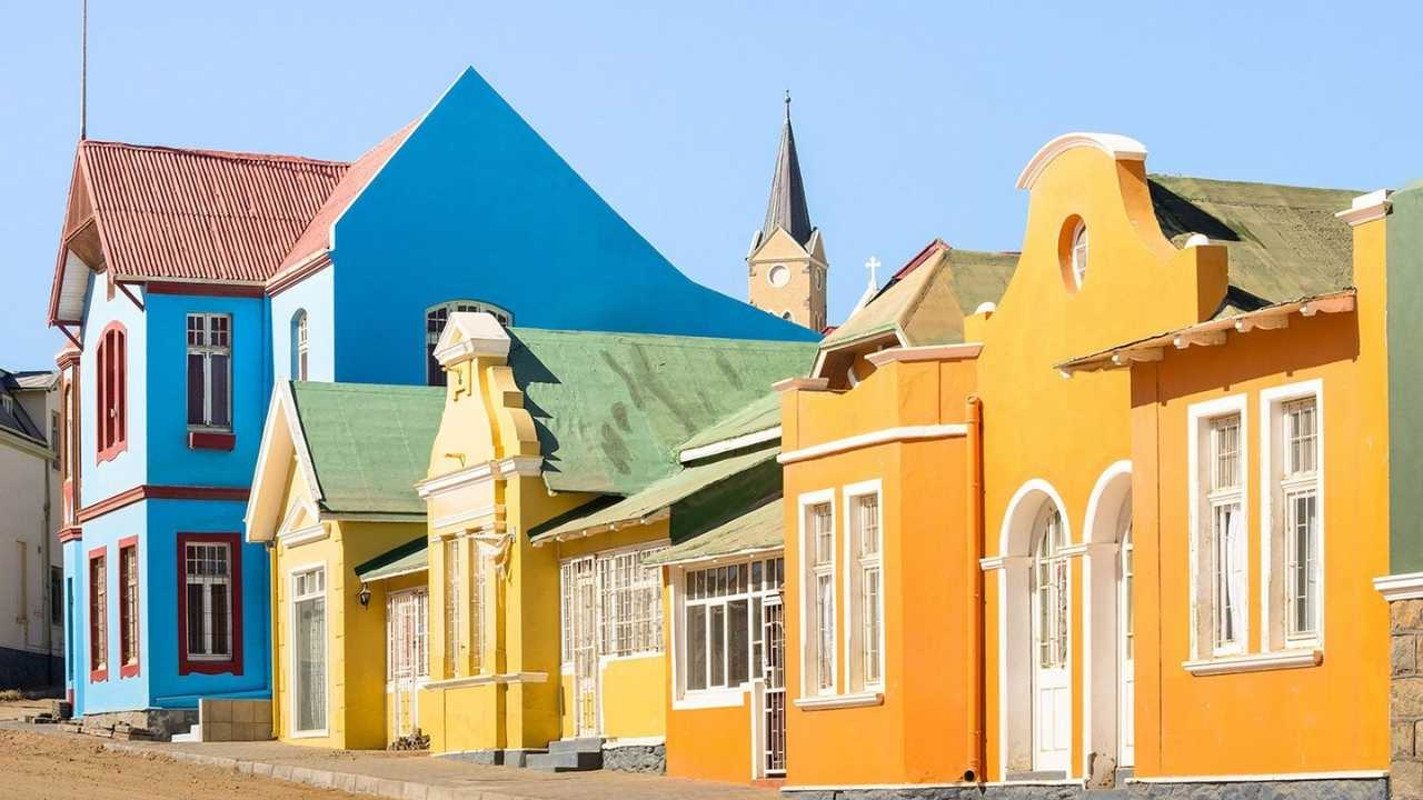 Old town buildings in Lüderitz, Namibia, showcasing colonial-era architecture.