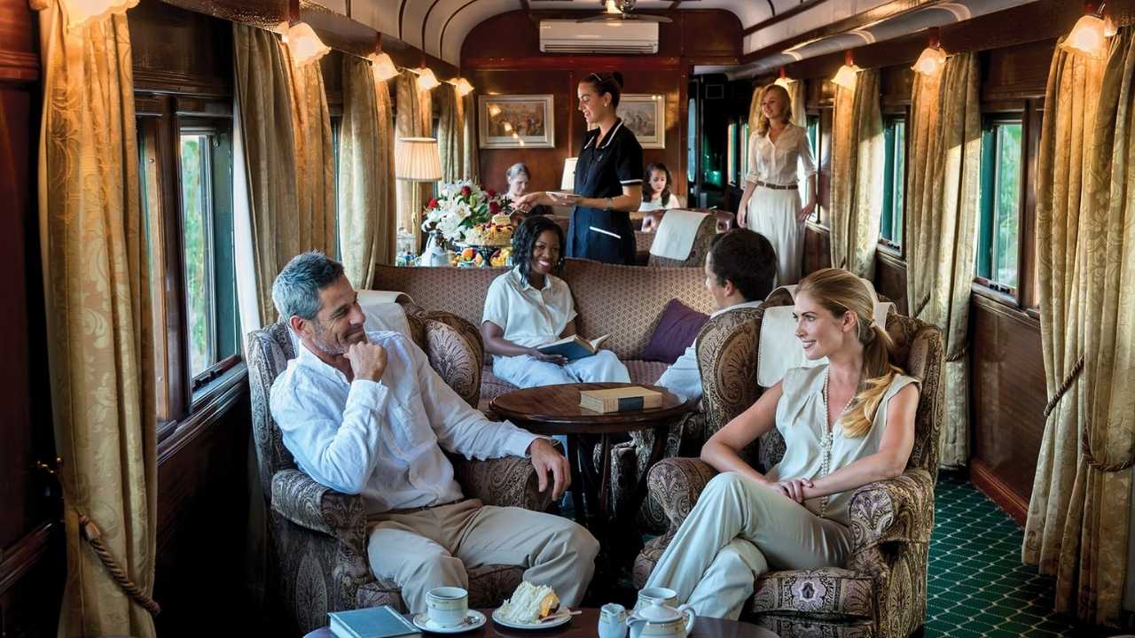 Rovos Rail luxury train travelling through African landscape.