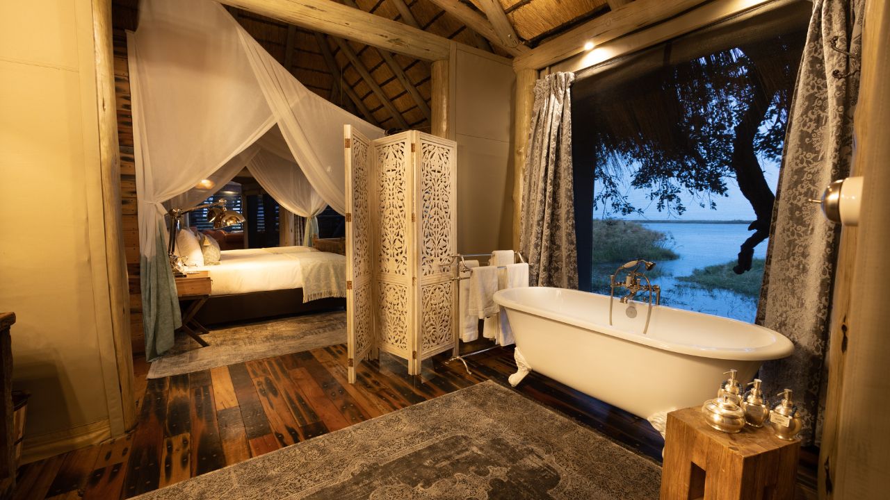 Bathroom in a guest room at Sitatunga Private Island with bathtub overlooking the Okavango Delta, Botswana.