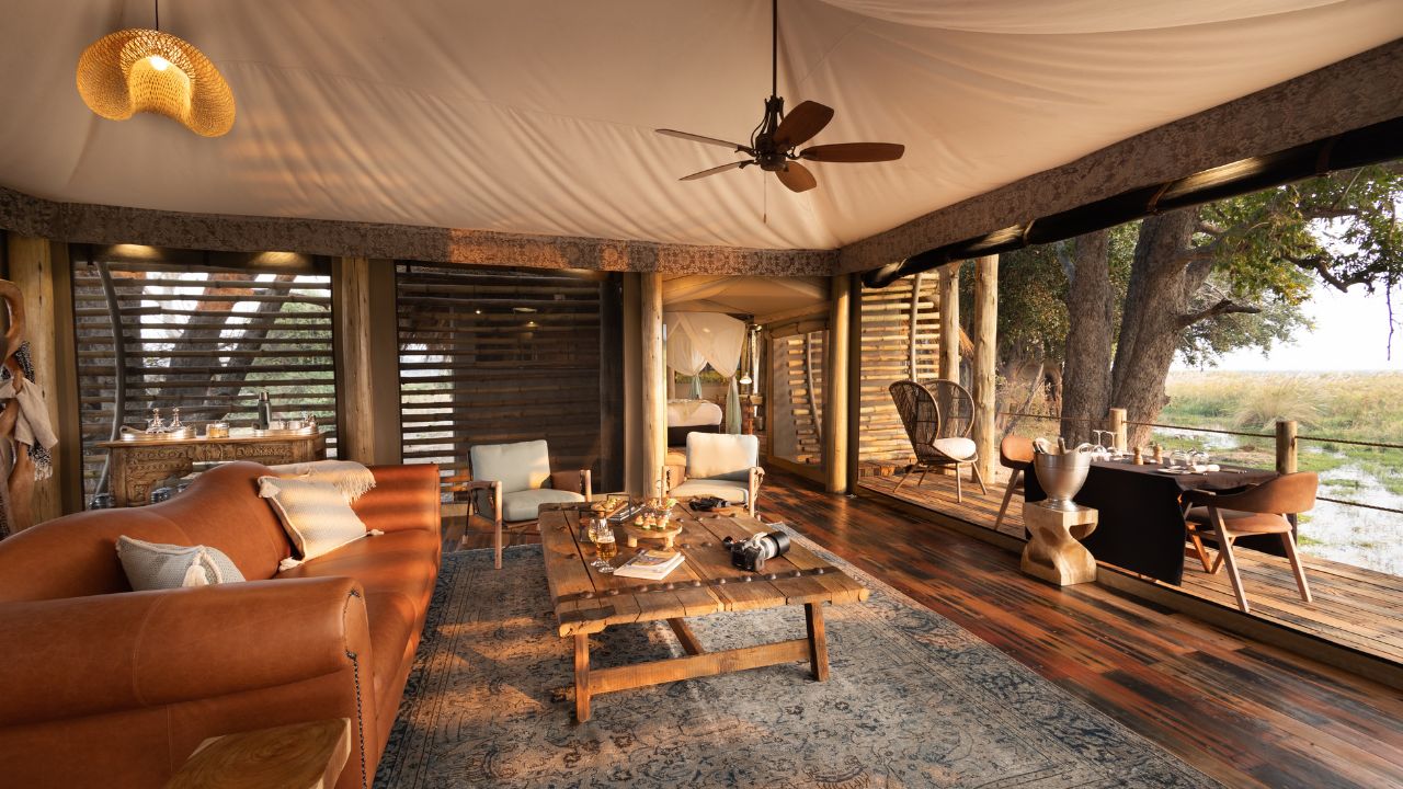 View from couch in double room at Sitatunga Private Island overlooking dining area and Okavango Delta, Botswana.