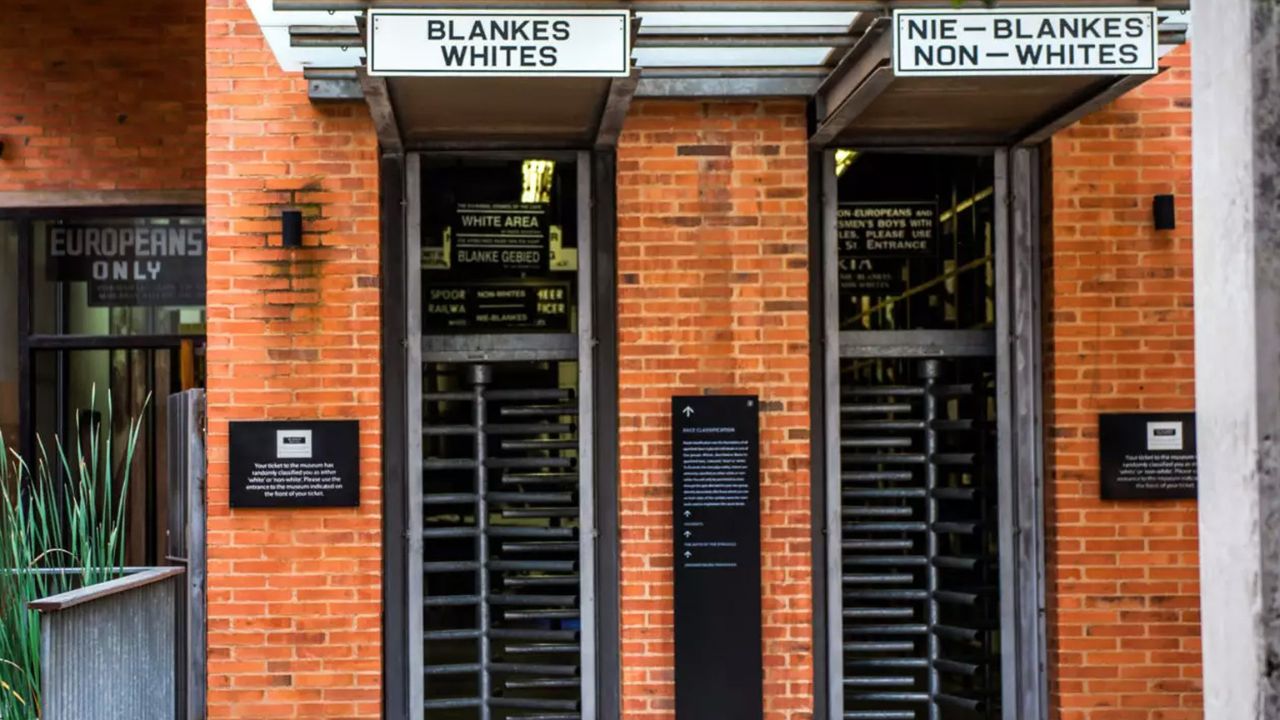 Apartheid Museum entrance with separate doors for blacks and whites