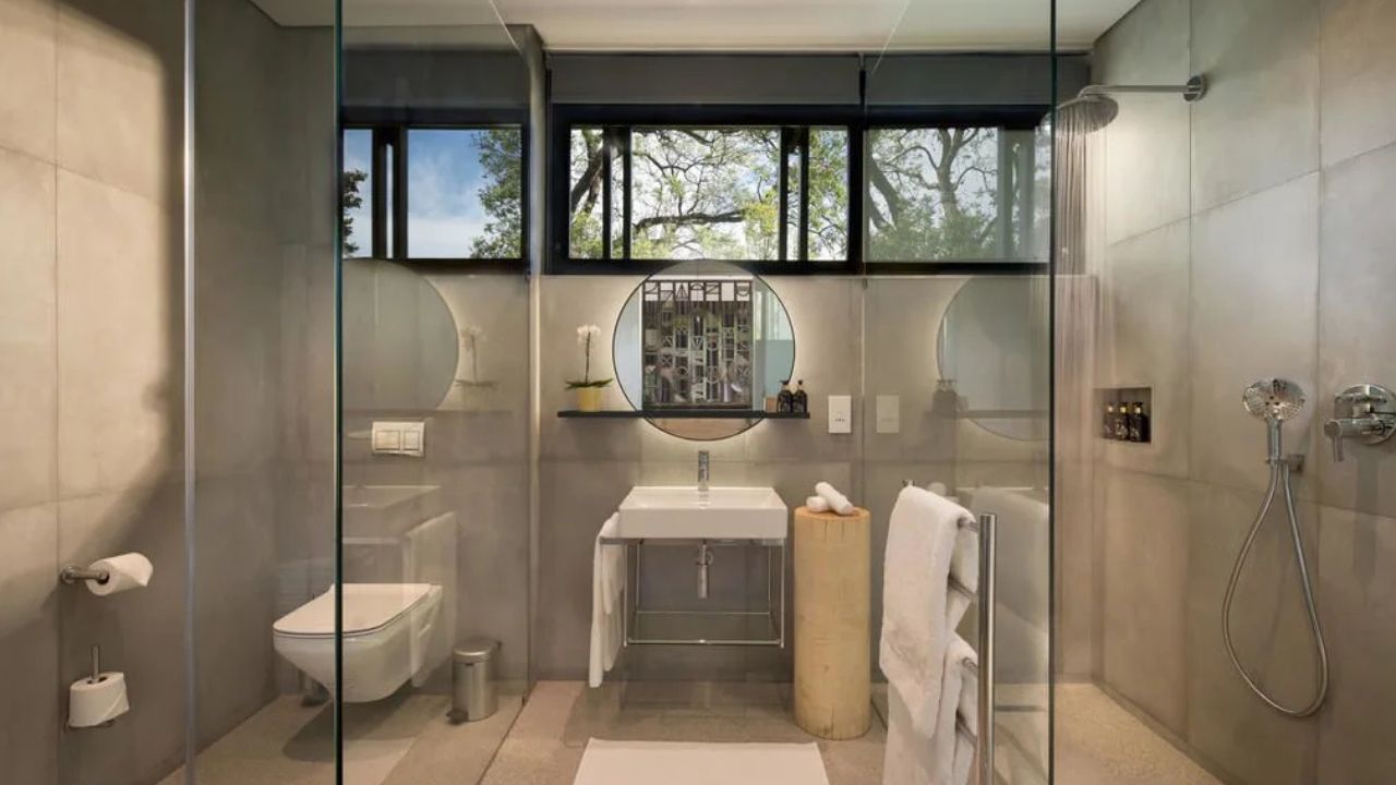 Modern bespoke bathroom with basin and shower in guest room at Peech Boutique Hotel