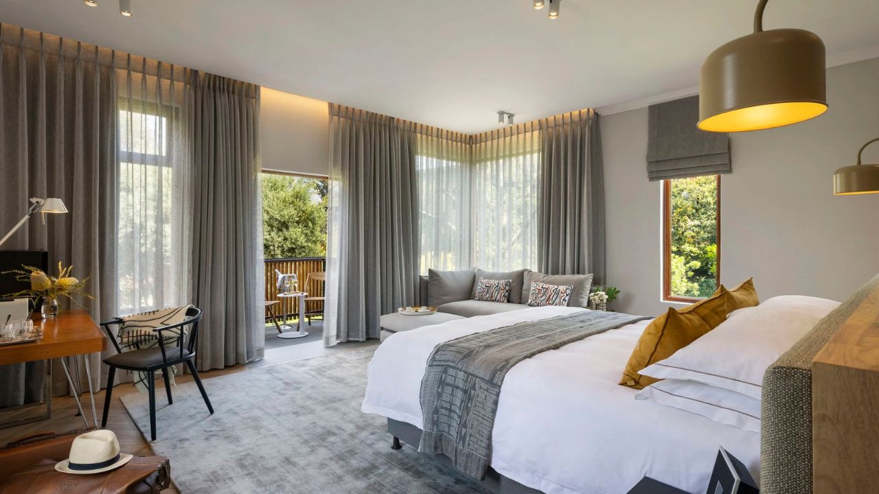 Luxury double room at Peech Boutique Hotel with back view toward exterior doorway