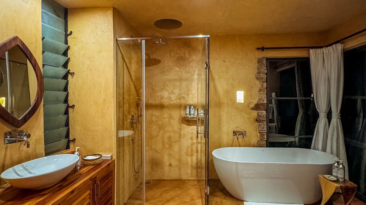 Bathroom with tub and shower Entebbe Forest Lodge Uganda