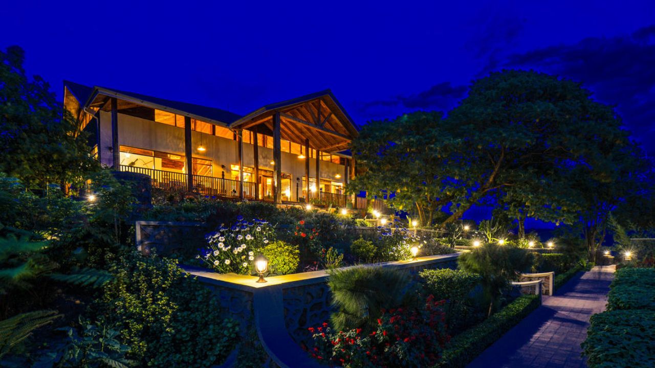 Nkuringo Bwindi Gorilla Lodge main building at night