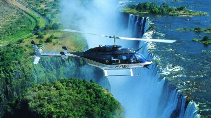 Helicopter flying over Victoria Falls Zimbabwe Flight of Angels