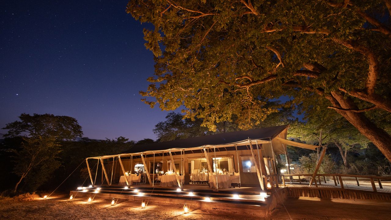 Luxury Verneys Camp lodge lit at night, Hwange National Park Zimbabwe