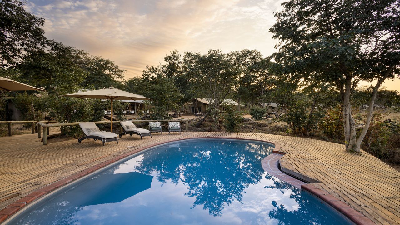 Verneys Camp guest pool at sunset, Hwange National Park Zimbabwe safari
