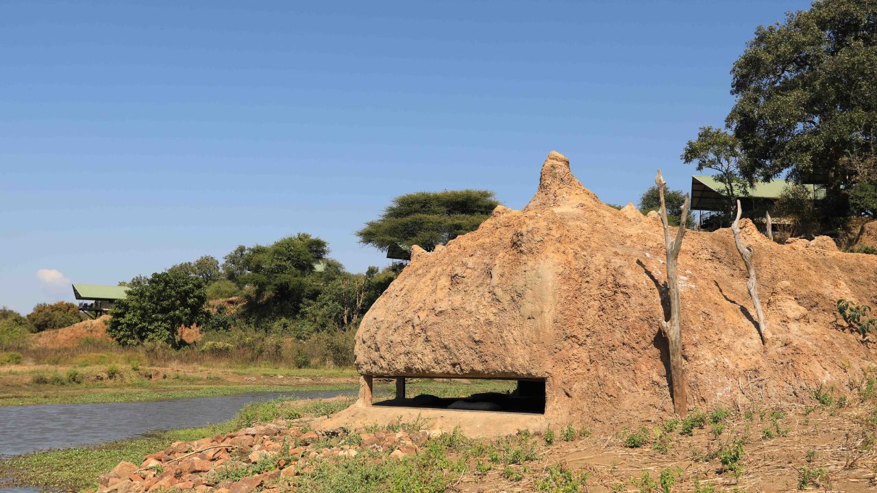 Wildlife viewing hide at Kavinga Camp overlooking watering hole in Zimbabwe