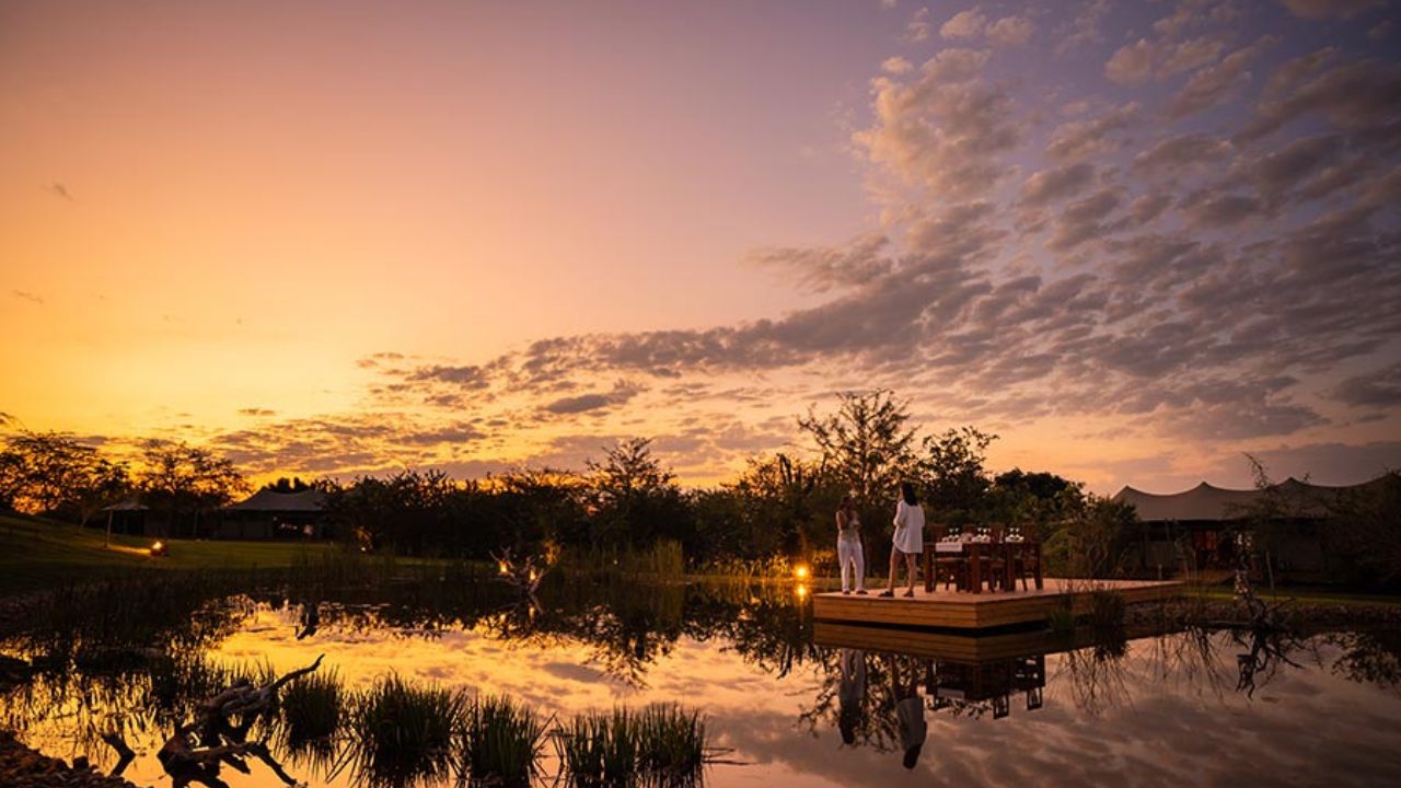 Sunset drinks on lake deck at Fothergill Island, Zimbabwe