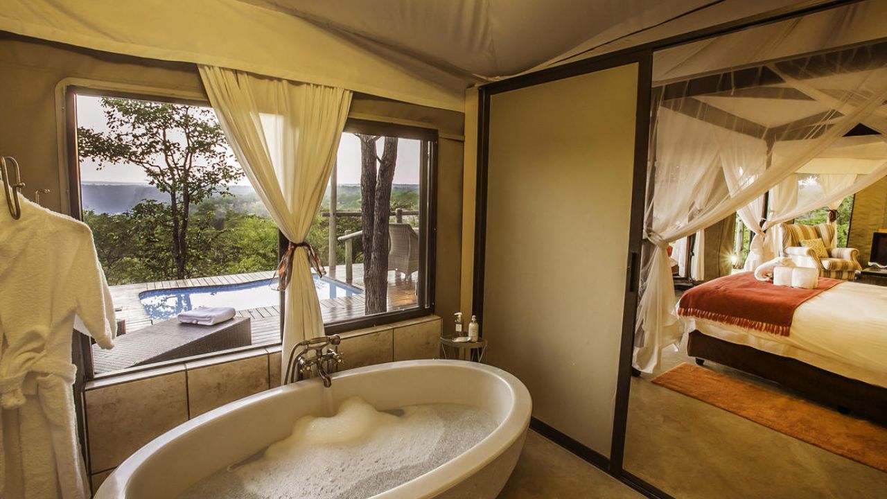 Freestanding bathtub with bush view at The Elephant Camp