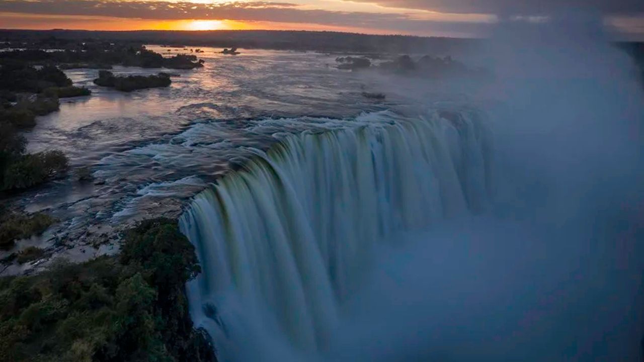 Victoria Falls in full flood at sunset, dramatic waterfall Zimbabwe